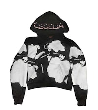 a black and white hoodie with the word vecela on it